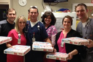 Nurses at Huntsville Hospital enjoying free pizza from NursingJobs.us during Nurses week 2013